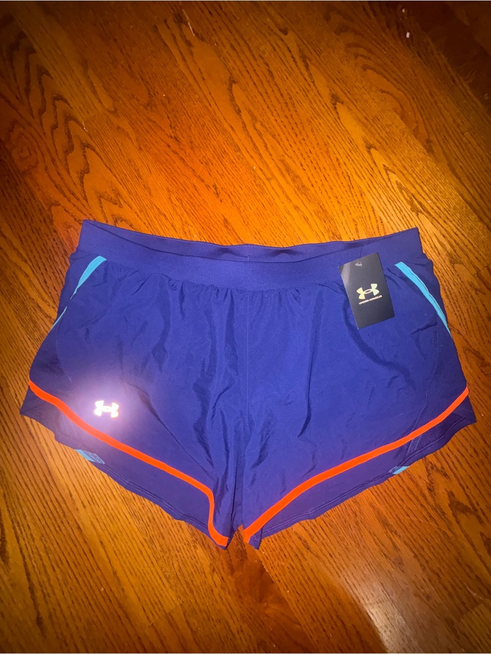 Under Armour Women’s Purple Athletic Shorts with Orange Trim